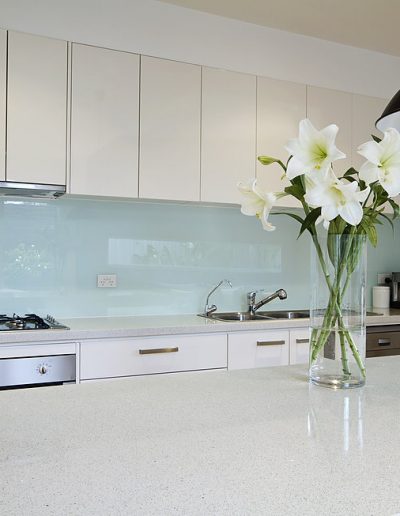 Flowers on contemporary kitchen bench